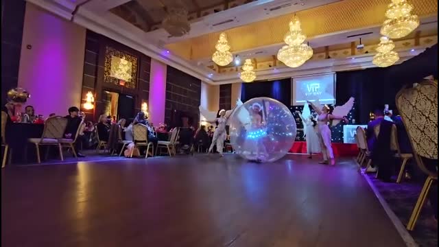 Angels and a ballerina in a big snow ball