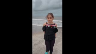 Cute girl dancing on the Beach